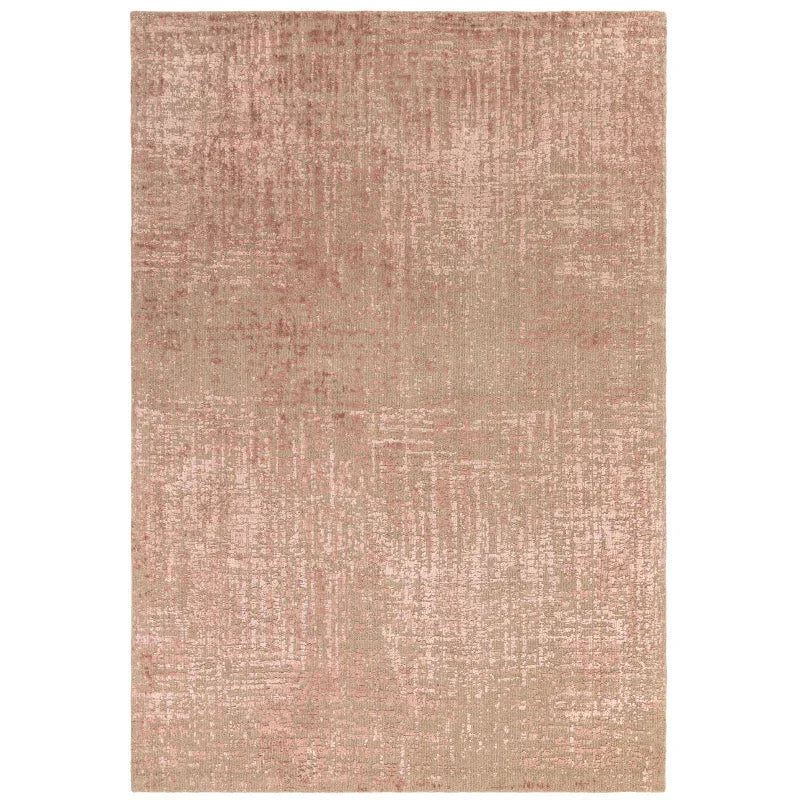 Pink and beige patterned area rug with textured abstract design