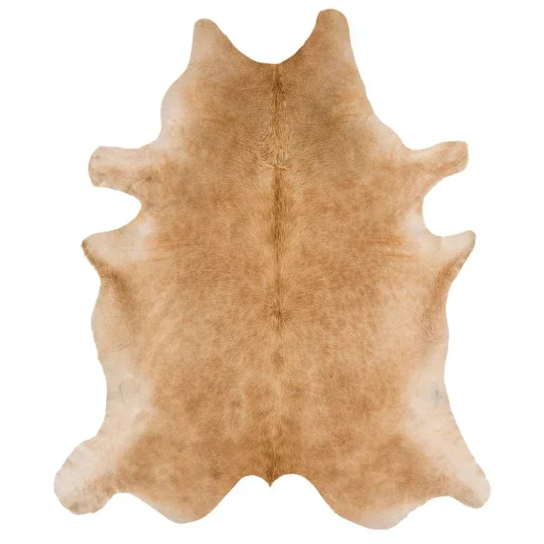 Light brown cowhide rug with natural texture and irregular edges on white background