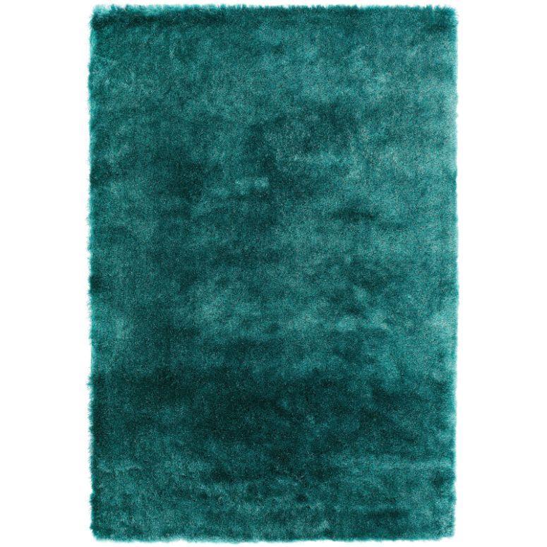 Teal shaggy area rug with plush texture and rectangular shape