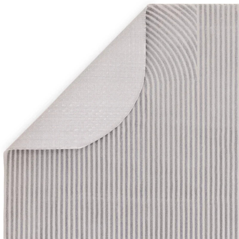 Grey striped rug with curved corner detail, showing pattern and texture