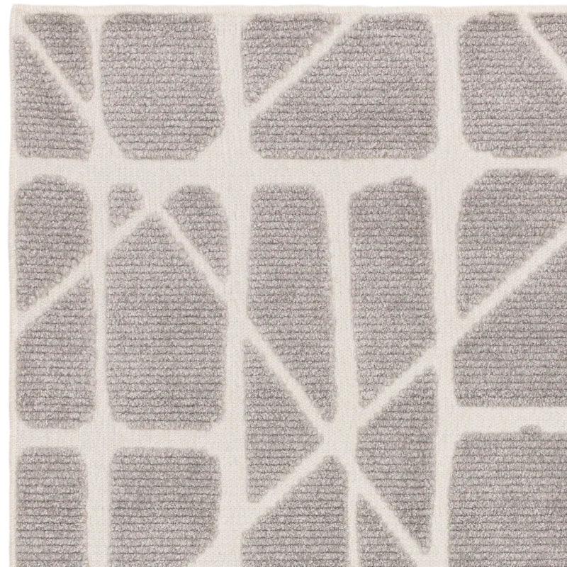 Grey geometric patterned area rug with textured rectangular shapes