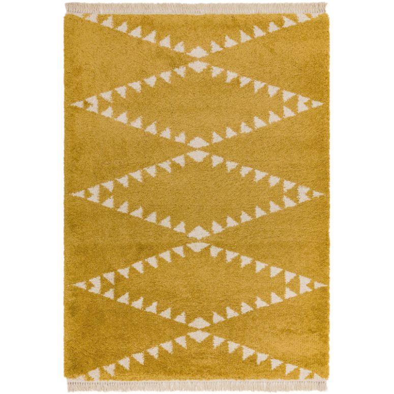 Yellow geometric rug with white triangle pattern and fringe detail on edges