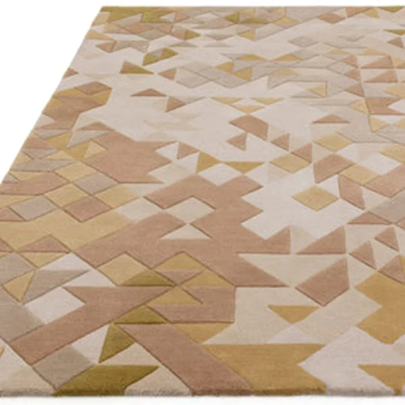 Geometric patterned area rug in beige, tan and muted yellow shades