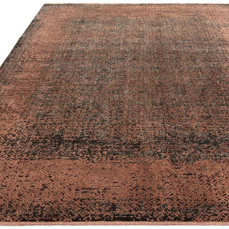 Modern brown and black area rug with textured pattern, shown from corner angle