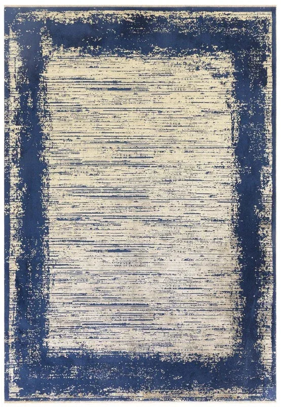 Blue and cream area rug with abstract border and distressed pattern