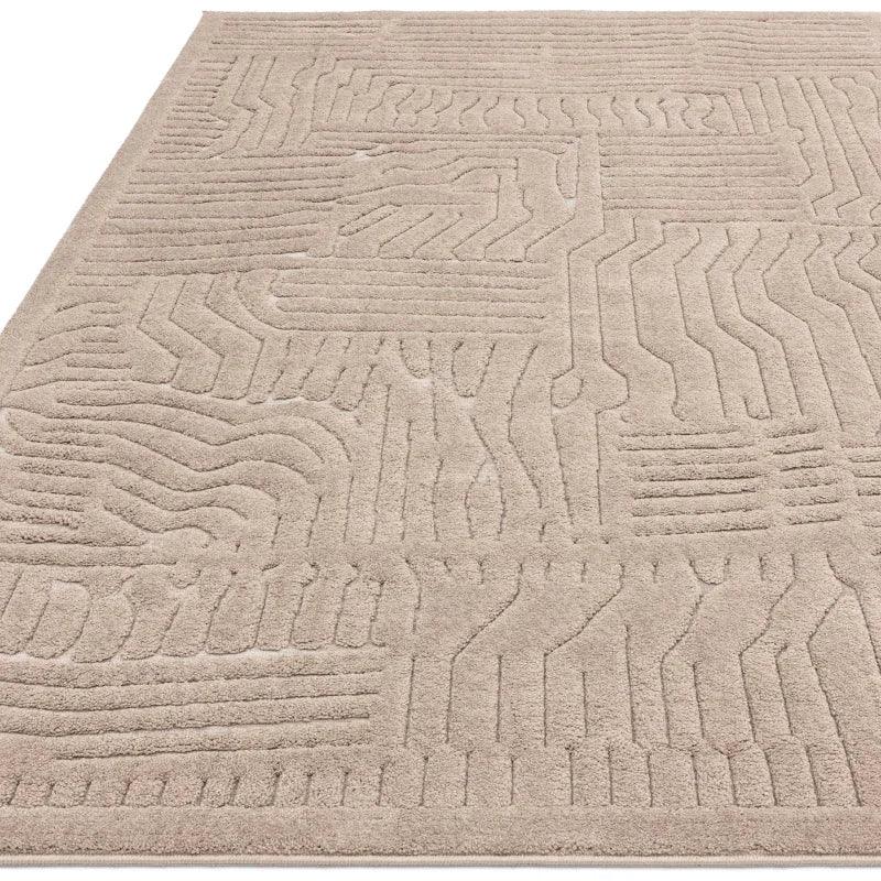 Beige textured area rug with geometric line pattern and soft pile
