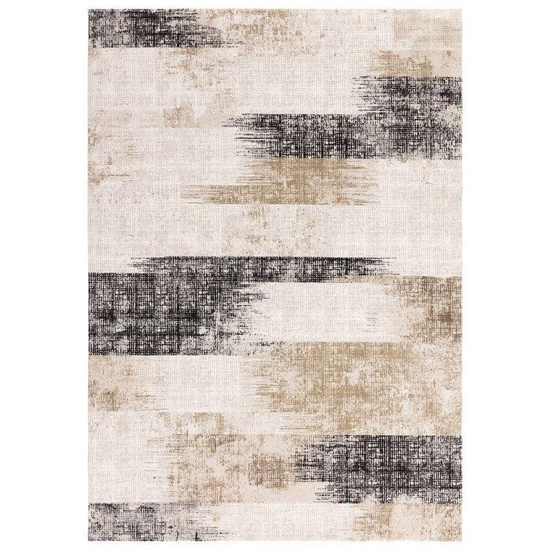 Modern area rug with abstract black and beige brushstroke pattern on a cream background
