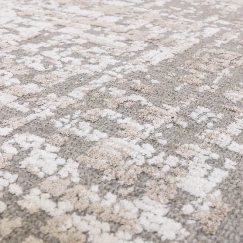 Beige and grey patterned rug close-up showing soft textured pile