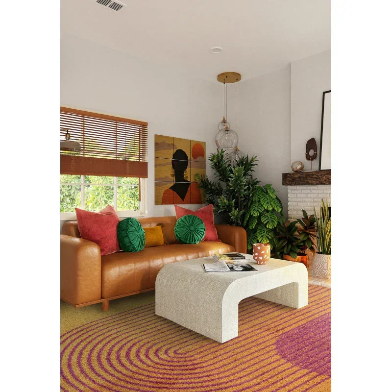 Tan leather sofa with colorful cushions and modern coffee table in stylish living room
