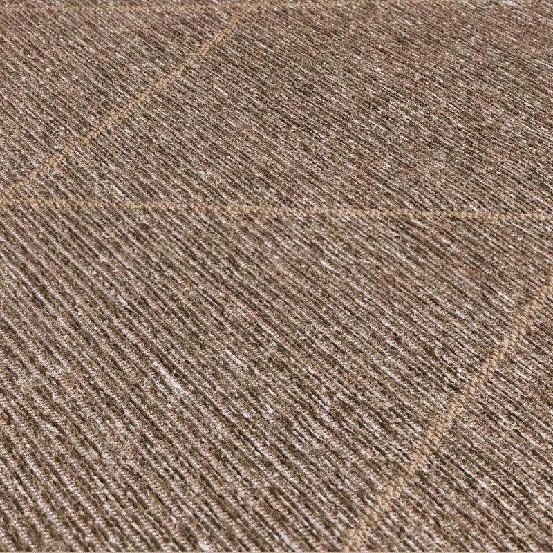 Beige textured area rug with diagonal stitched lines and subtle ribbed pattern