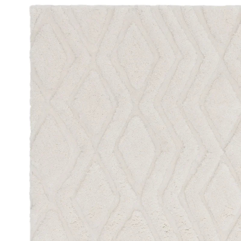 Textured cream rug with diamond pattern and plush surface, shown from overhead angle