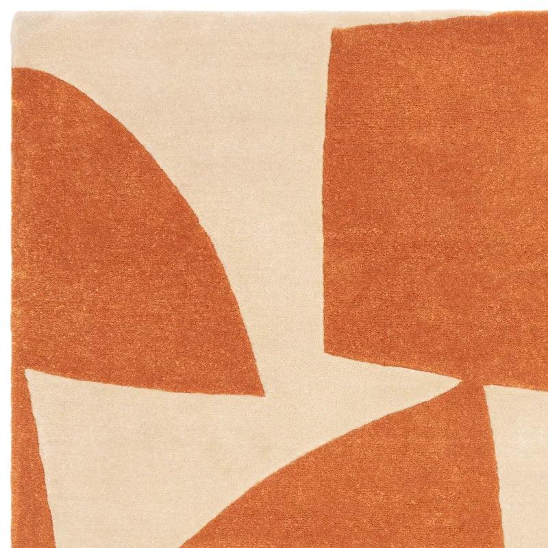 Modern abstract area rug with rust and beige geometric shapes