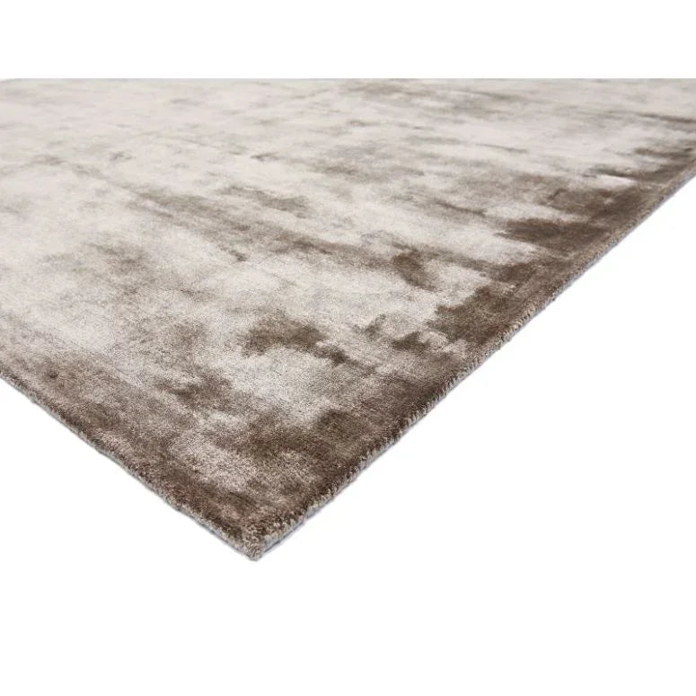 Beige and brown area rug with soft texture and subtle gradient pattern