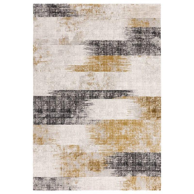Modern abstract area rug with gold and black textured stripes on a cream background