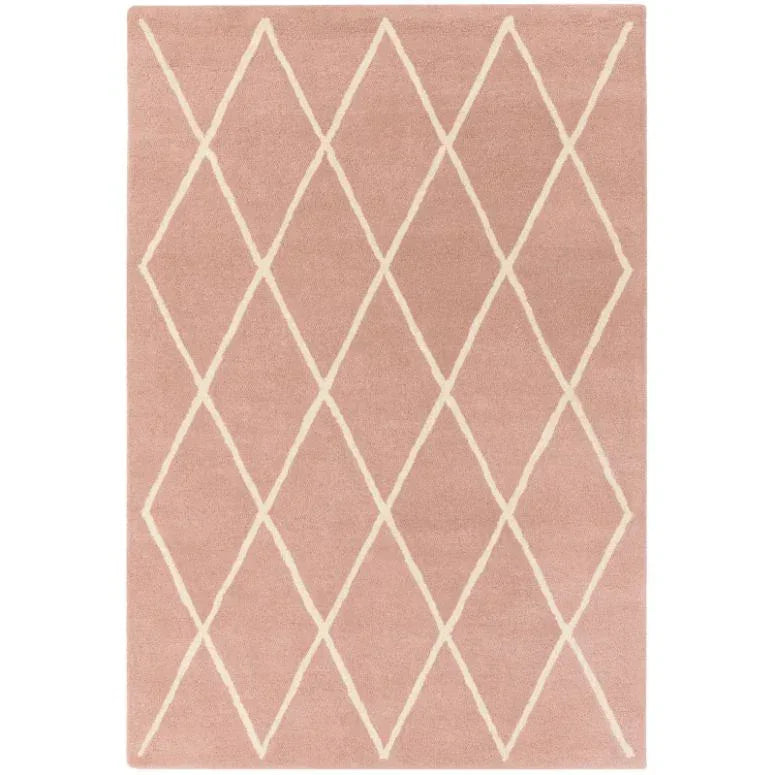 Blush pink area rug with cream diamond geometric pattern, top view