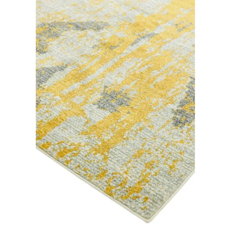 Abstract yellow and grey rug with textured pattern and straight corner detail