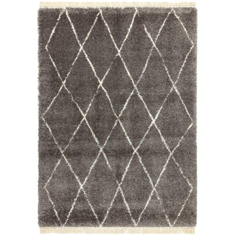 grey area rug with white diamond pattern and fringe edges