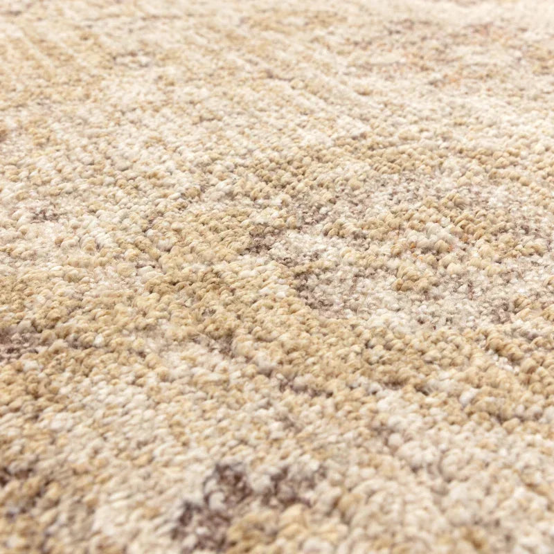 Beige textured rug close-up showing woven pattern and soft loop pile