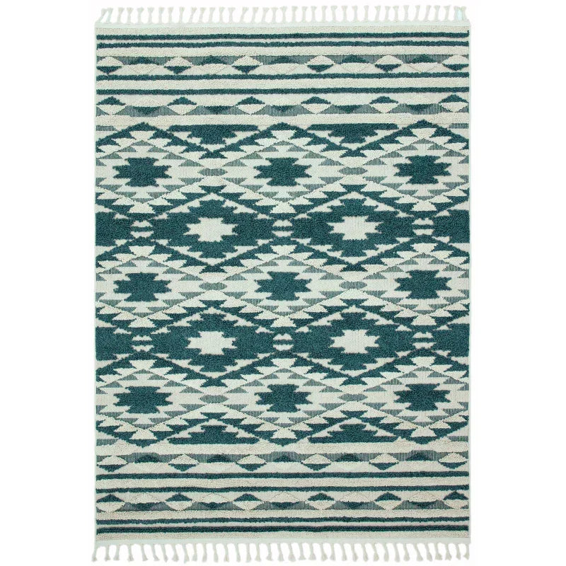 Green and cream patterned area rug with geometric design and fringed edges