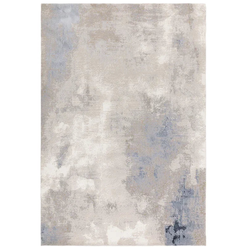 Modern abstract area rug in grey and blue tones with a textured pattern
