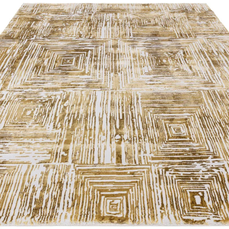 Geometric gold and white area rug with abstract square pattern, shown from a front angle