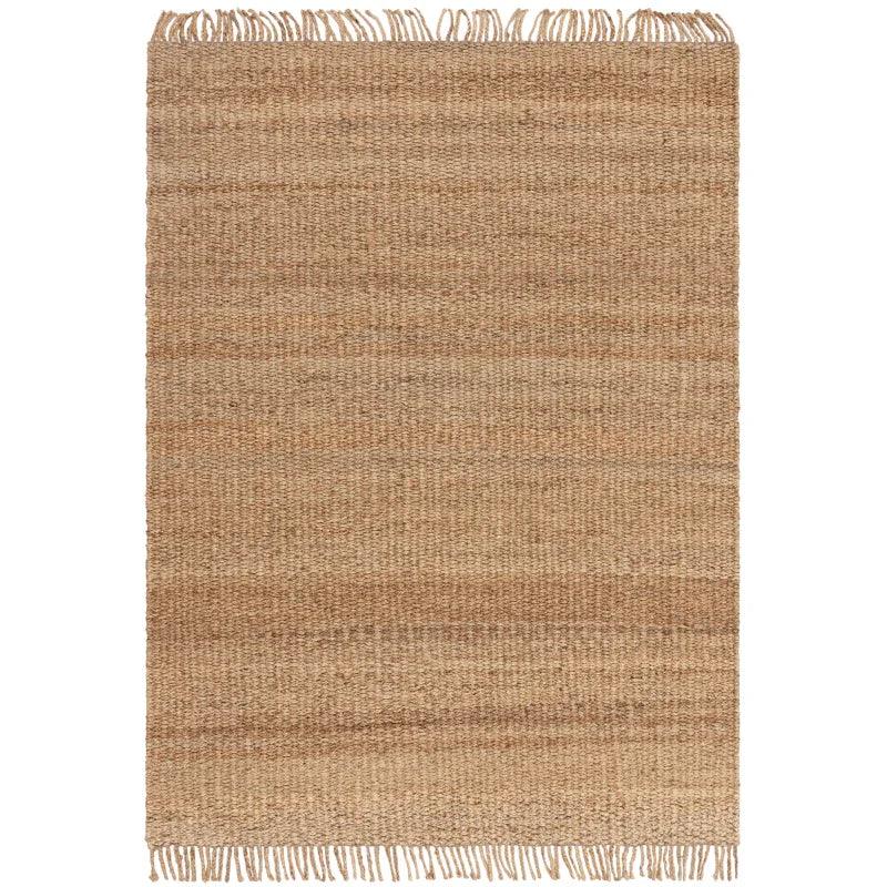 Natural jute rug with fringe edges and textured weave, rectangular shape