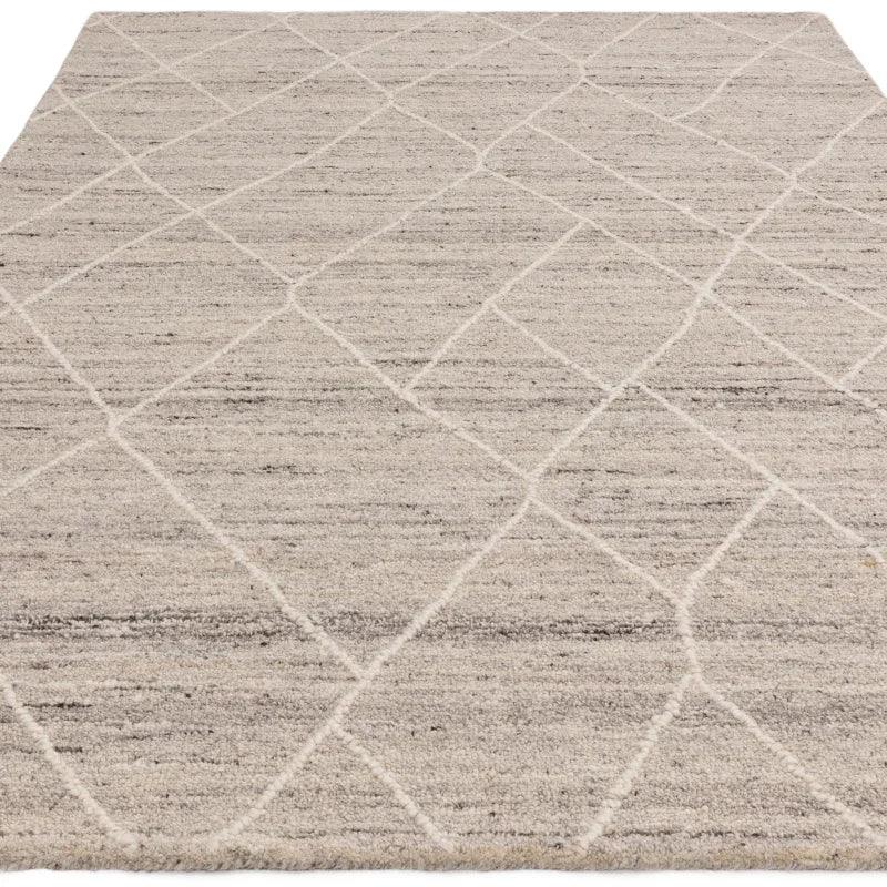 Beige area rug with subtle diamond pattern texture, flat-lay view