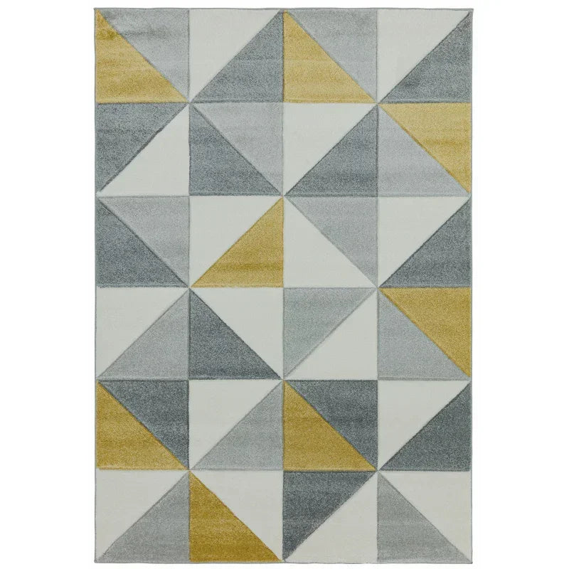 Geometric area rug with grey, gold, and white triangles in a modern pattern