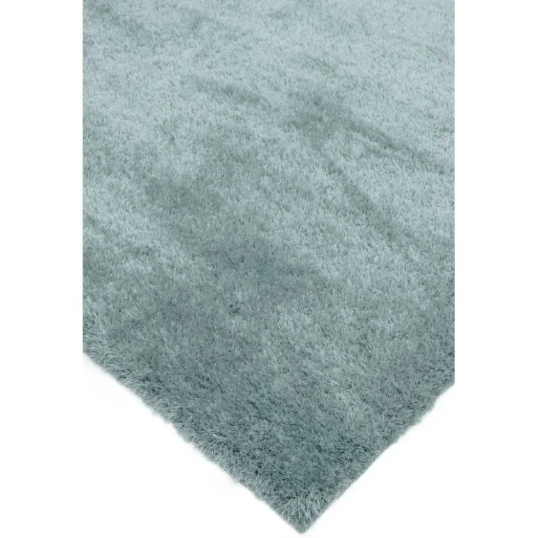 Light grey shaggy rug with soft texture and thick pile close-up view