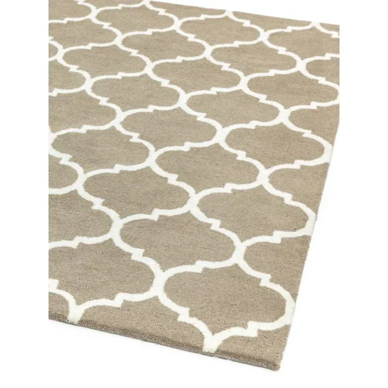 Beige area rug with white geometric trellis pattern, corner view, textured finish