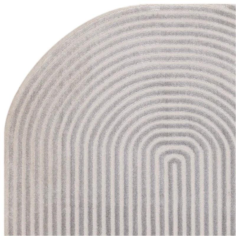 Grey modern area rug with rounded corner and raised arch pattern detail