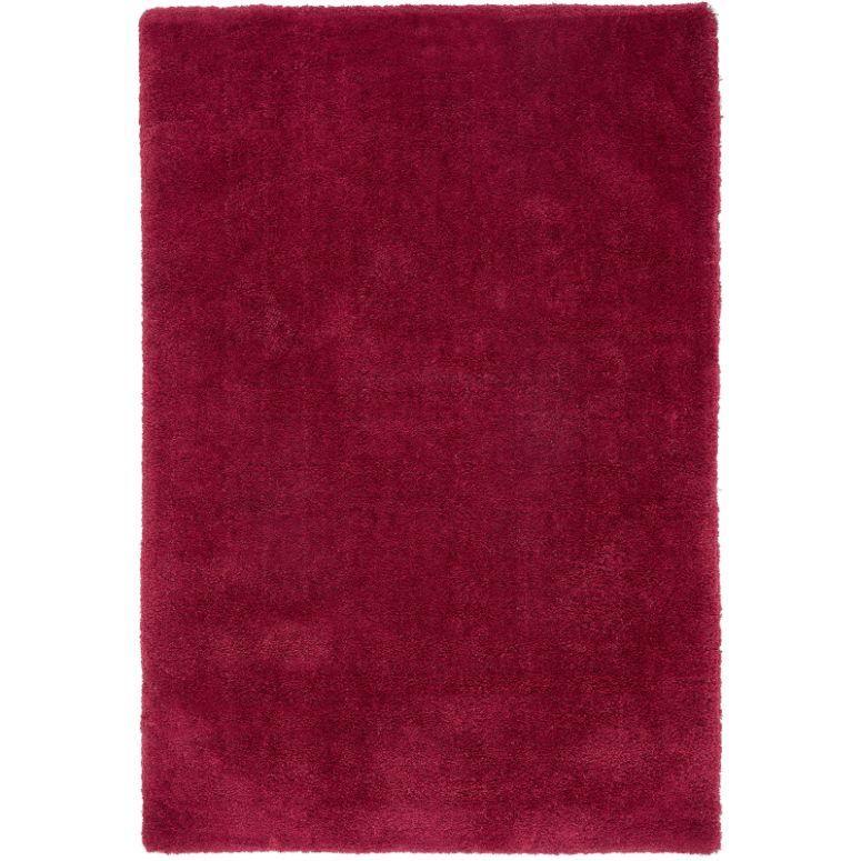 Rectangular red area rug with plush pile and plain surface