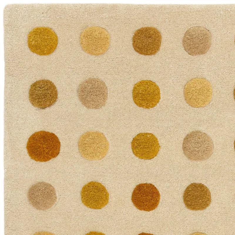 beige area rug with rows of textured brown and yellow polka dots