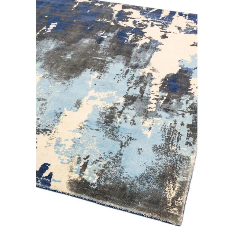 Modern area rug with blue, grey and cream abstract pattern