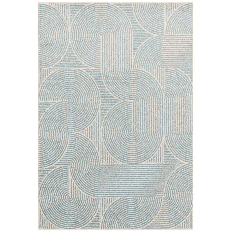 Blue and cream geometric rug with curved line pattern, top-down view