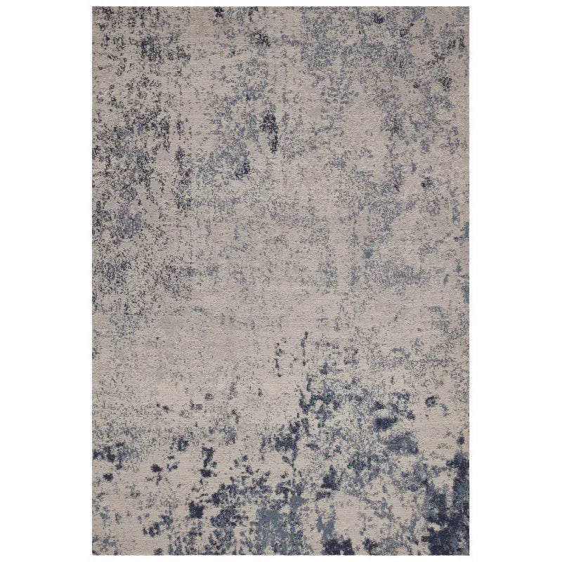 modern abstract area rug with blue and grey pattern on beige background