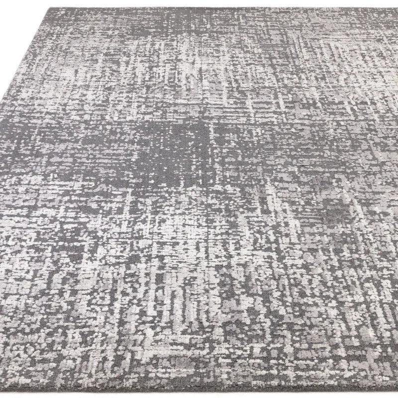 Grey abstract area rug with textured pattern and soft pile