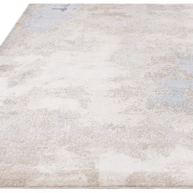 Neutral area rug with subtle abstract pattern and soft texture, angled front view