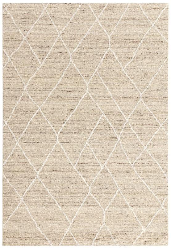 Beige area rug with subtle white geometric diamond pattern