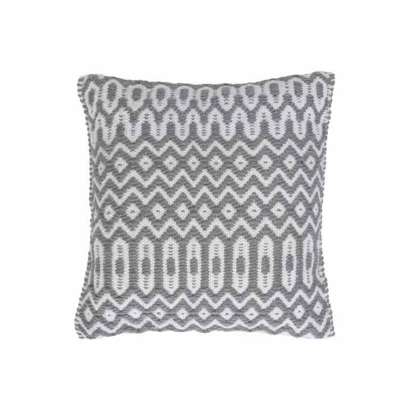Grey patterned cushion with white zigzag and diamond design, textured fabric front view