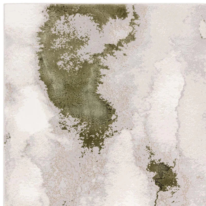 Modern area rug with abstract olive green and cream pattern, close-up texture view