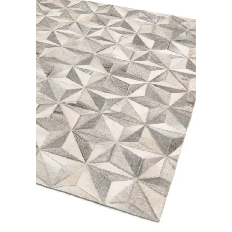 Grey geometric pattern area rug with textured triangular shapes
