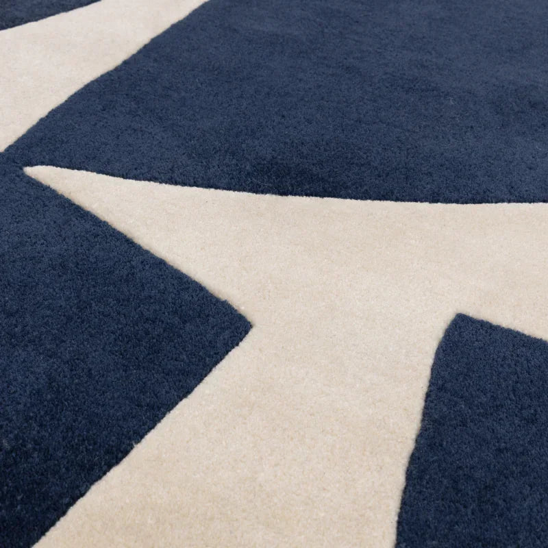 Navy and cream modern geometric pattern rug close-up