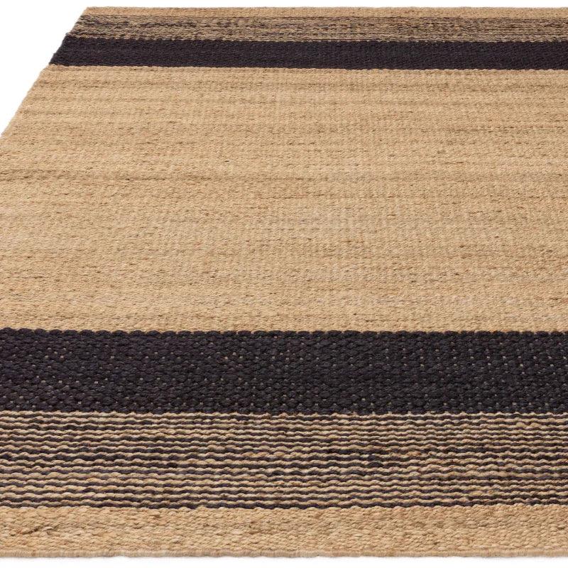natural jute rug with black stripes and textured weave pattern