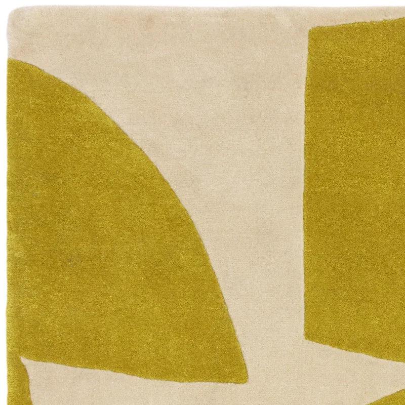Modern rug with abstract yellow and cream geometric pattern close-up