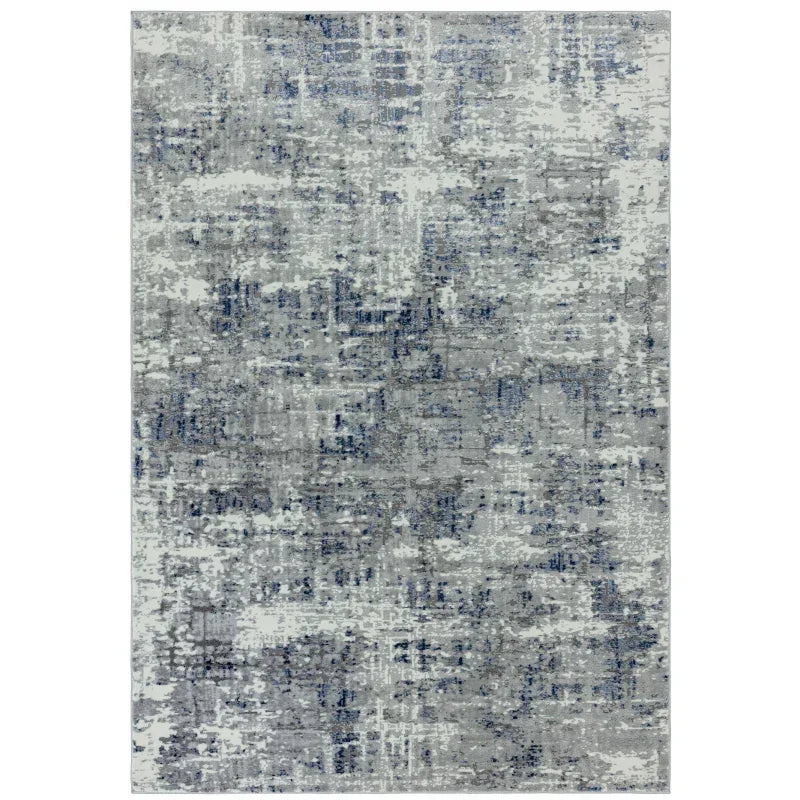 grey and blue abstract area rug with textured pattern and rectangular shape