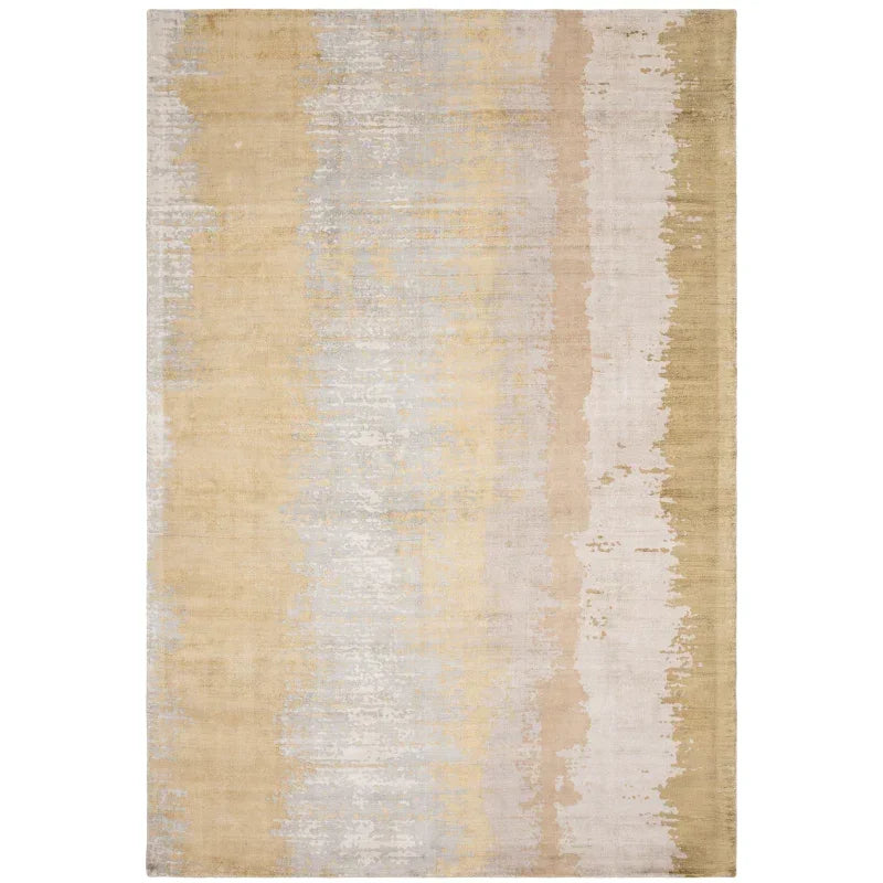 Beige and cream abstract area rug with subtle gradient pattern