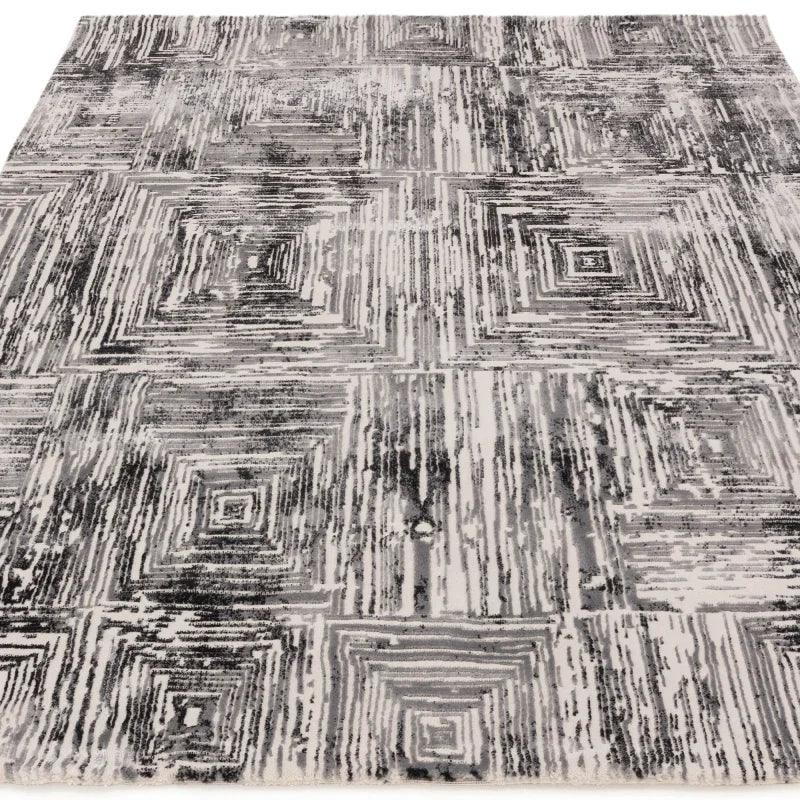 grey patterned area rug with geometric square design and textured finish
