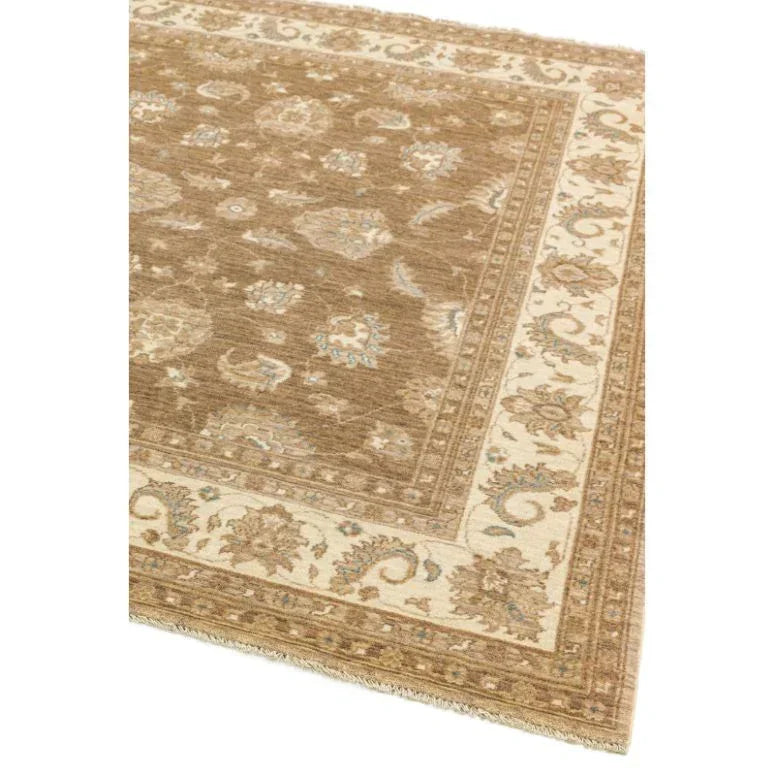 Brown patterned area rug with cream floral border and traditional design details