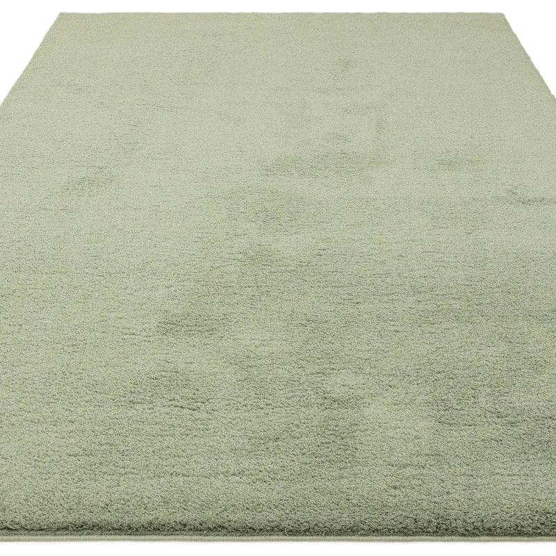 Light green area rug with soft textured pile, shown from a slightly angled top view